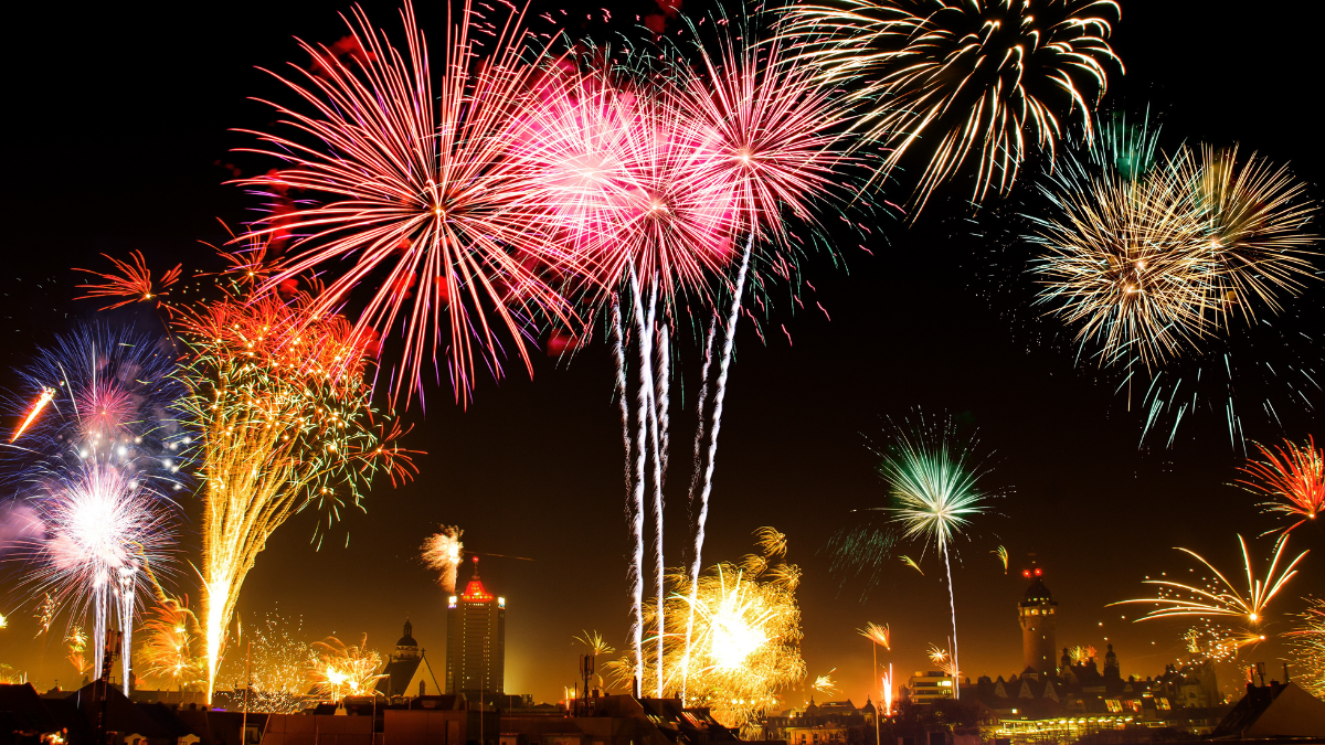 Fireworks set off over a city for the blog post 6 New Year Celebrations Around the World